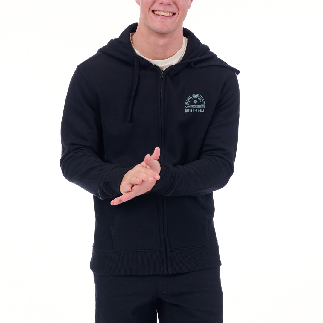 Person wearing a black hoodie with a logo on a white background
