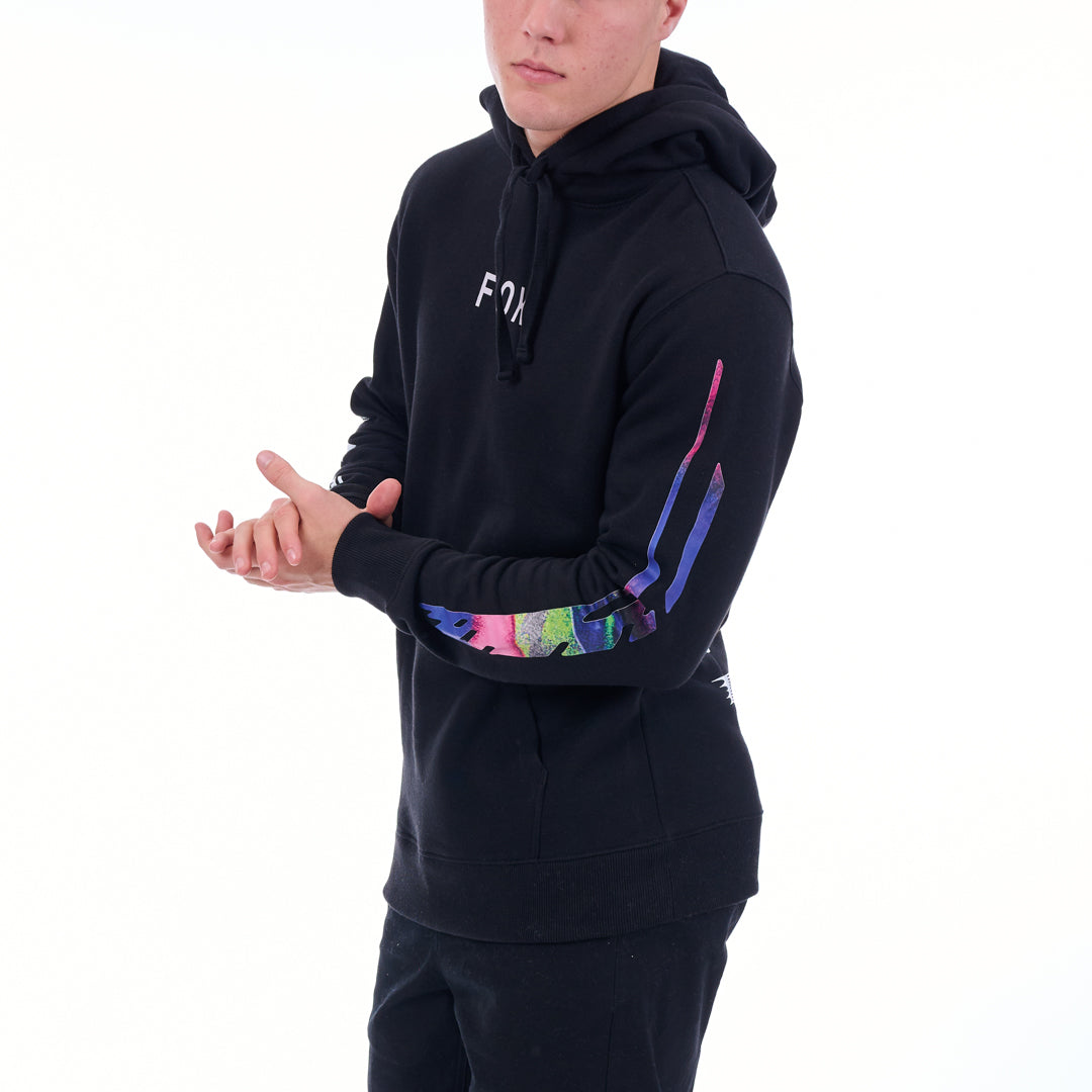 Person wearing a black hoodie with colorful designs on the sleeves against a white background